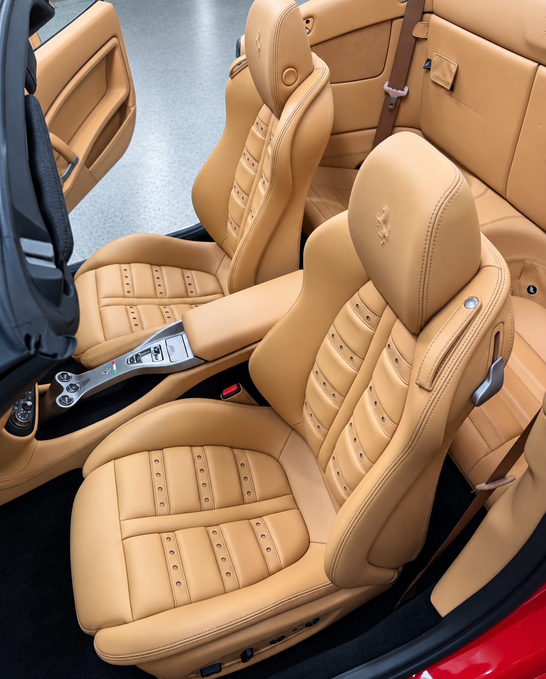 Tan leather seats and detailed stitching in a convertible interior
