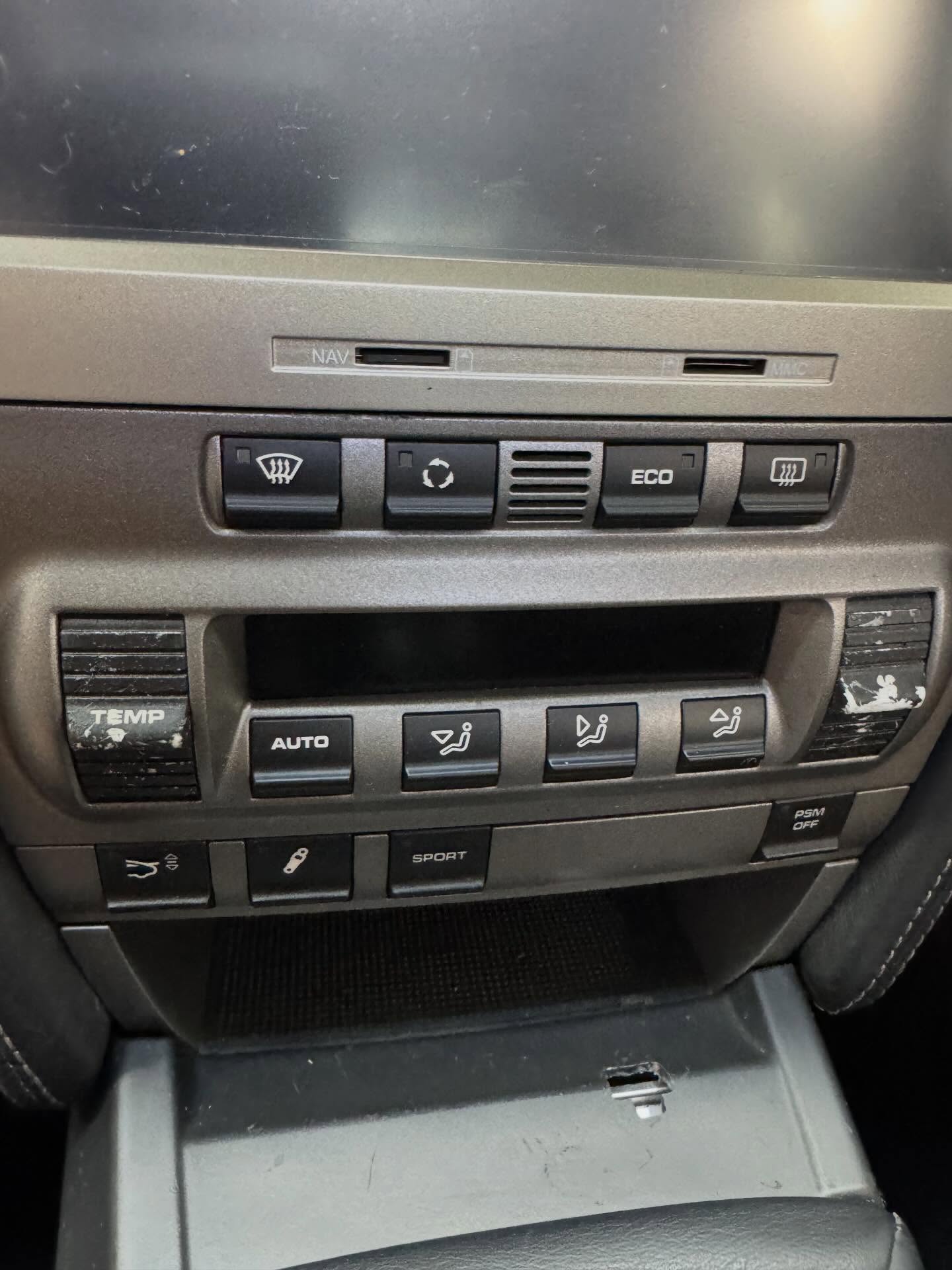 Before: worn climate control switches and faded markings